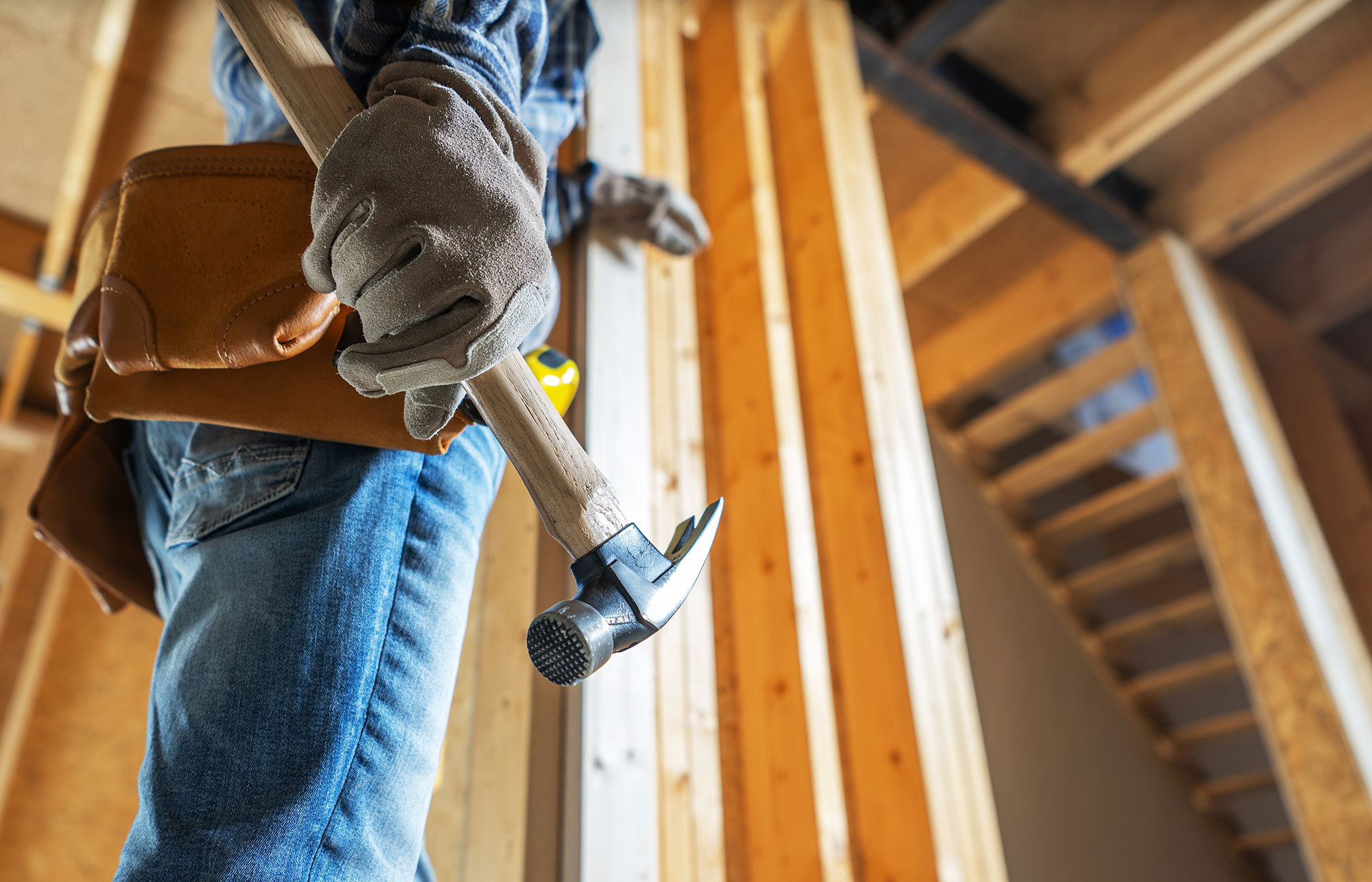 Construction worker with hammer at job site